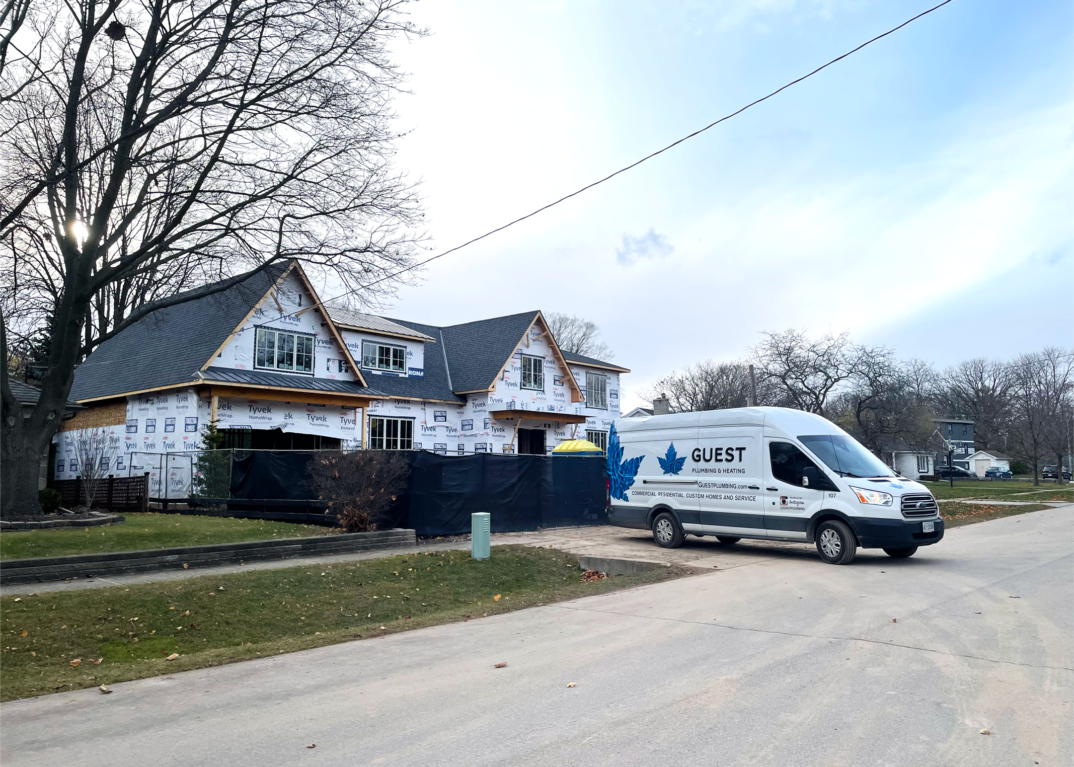 The Guest Van in front of a custom home